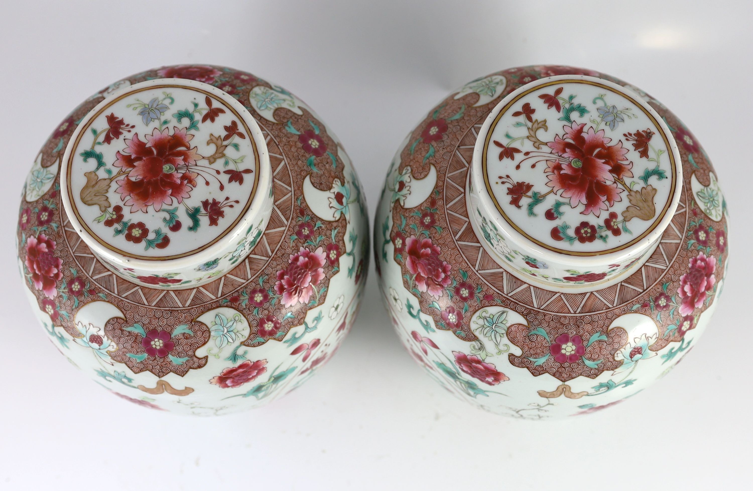 A good pair of Chinese famille rose ovoid jars and covers, 19th century, 28.5 cm high